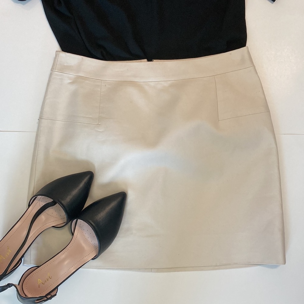 Cream jcrew miniskirt with faux pockets